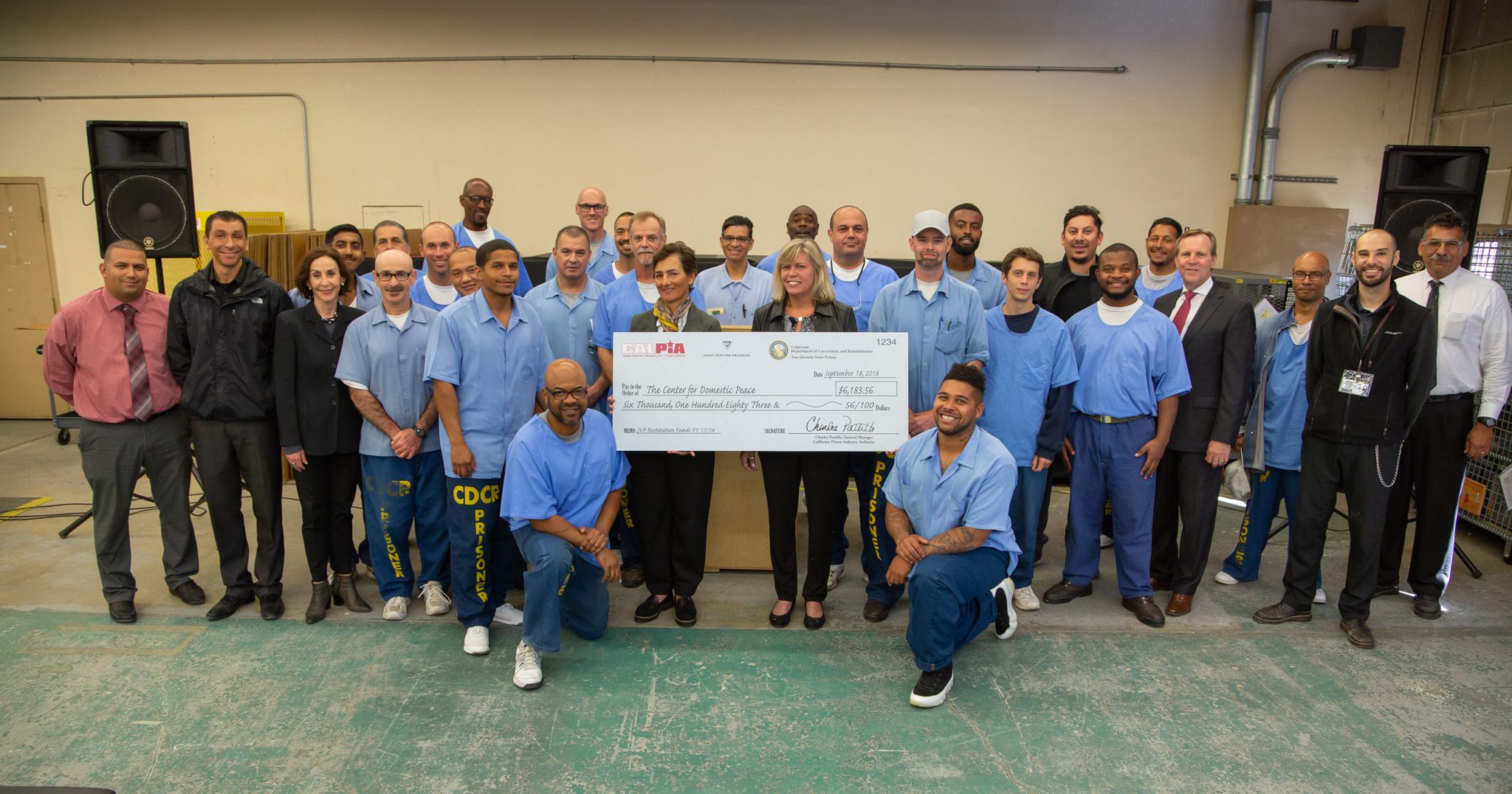 Joint Venture Program - incarcerated individuals posting a group picture